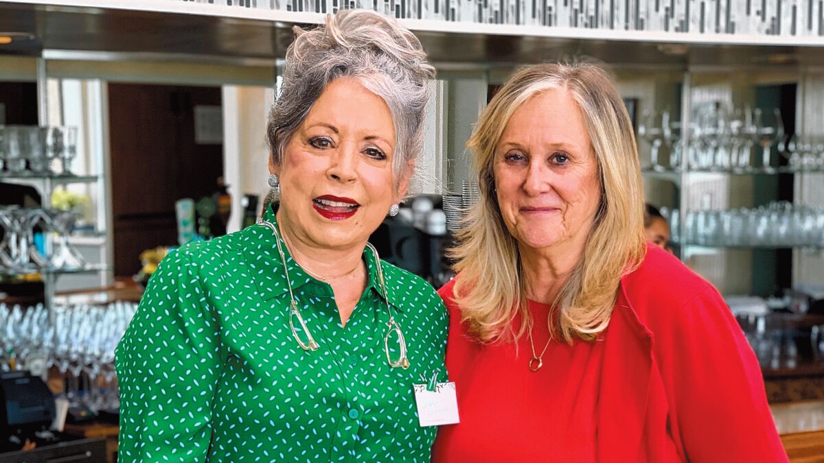 Event co-chairs Carolynn LaPierre and Roz Bradley attend the Village Garden Club of La Jolla's Holiday Luncheon, Dec. 12, 2019 at The Marine Room in La Jolla.