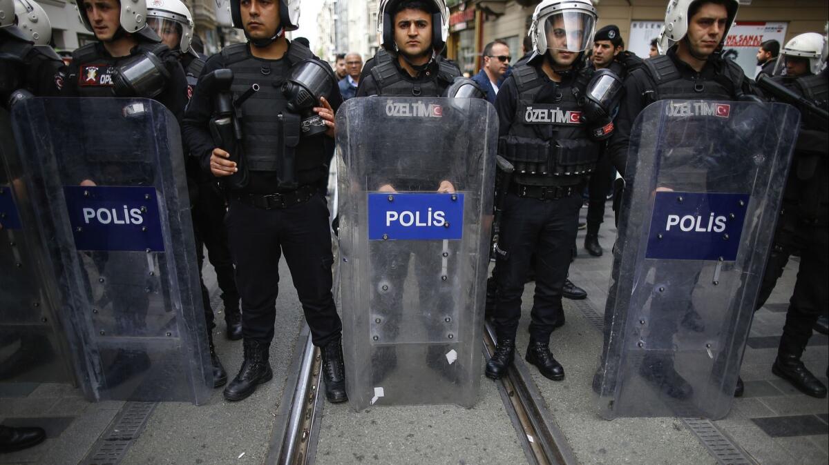 Turkish police look on as supporters of Turkey's main opposition, the Republican People's Party, gather at an April 2018 protest.