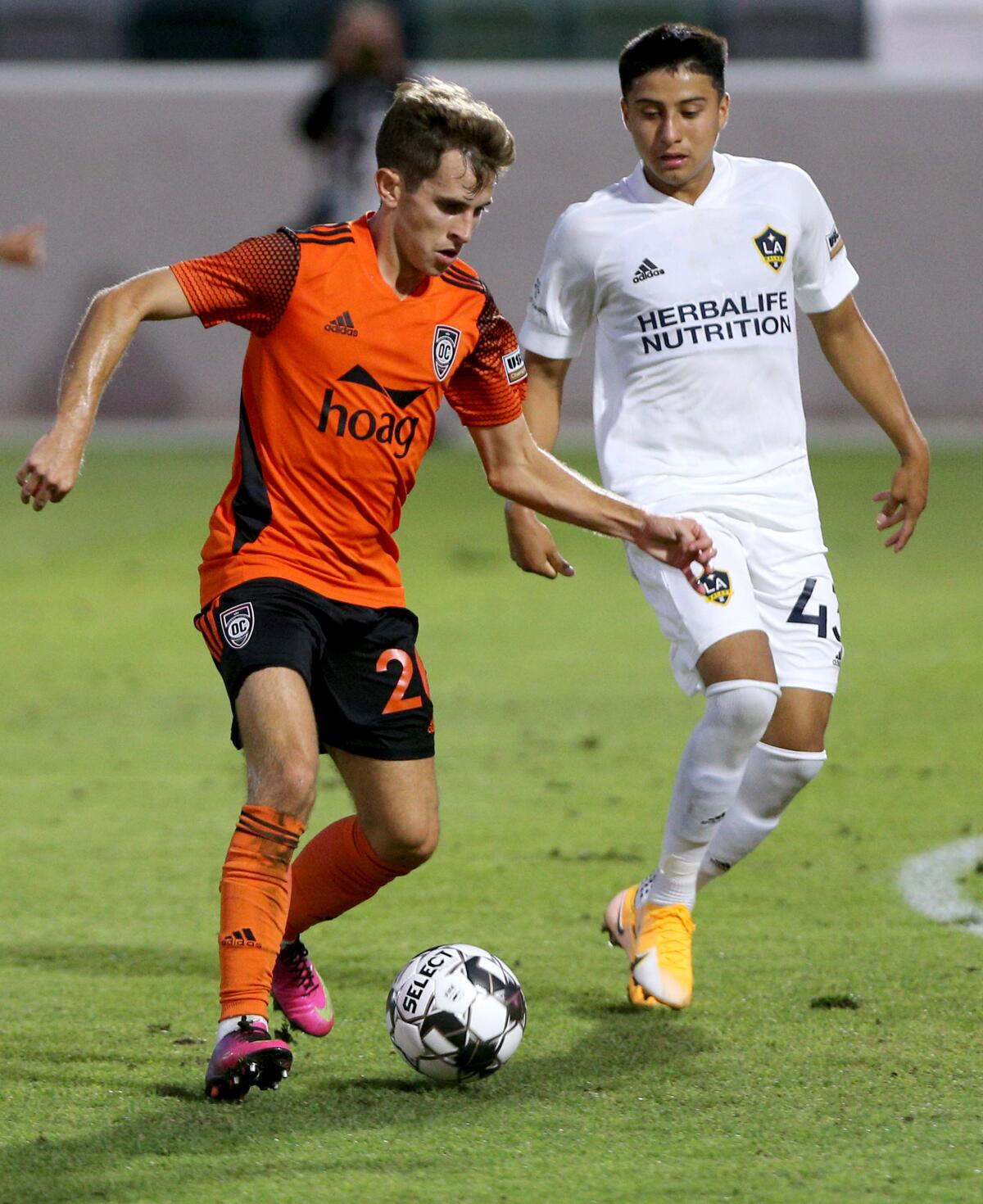 Orange County Soccer Club midfielder Brian Iloski controls the ball.