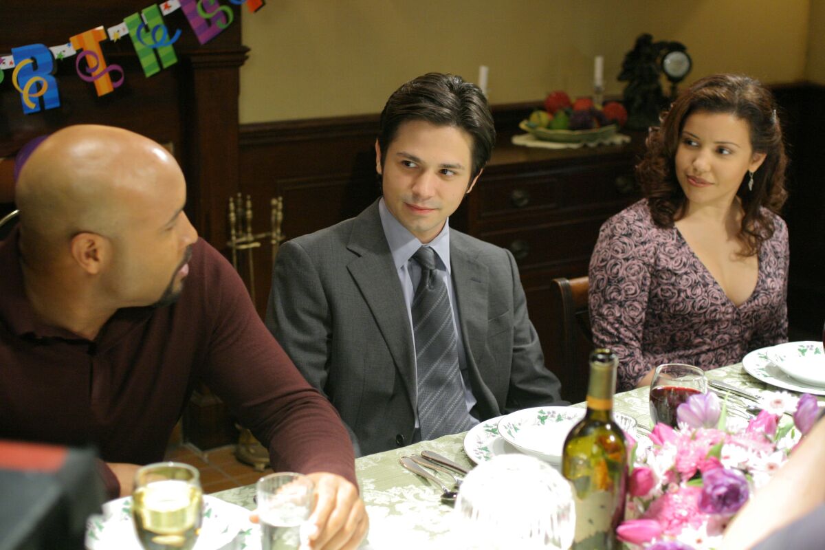 Mathew St. Patrick, Freddy Rodriguez, and Justina Machado in a scene from "Six Feet Under."