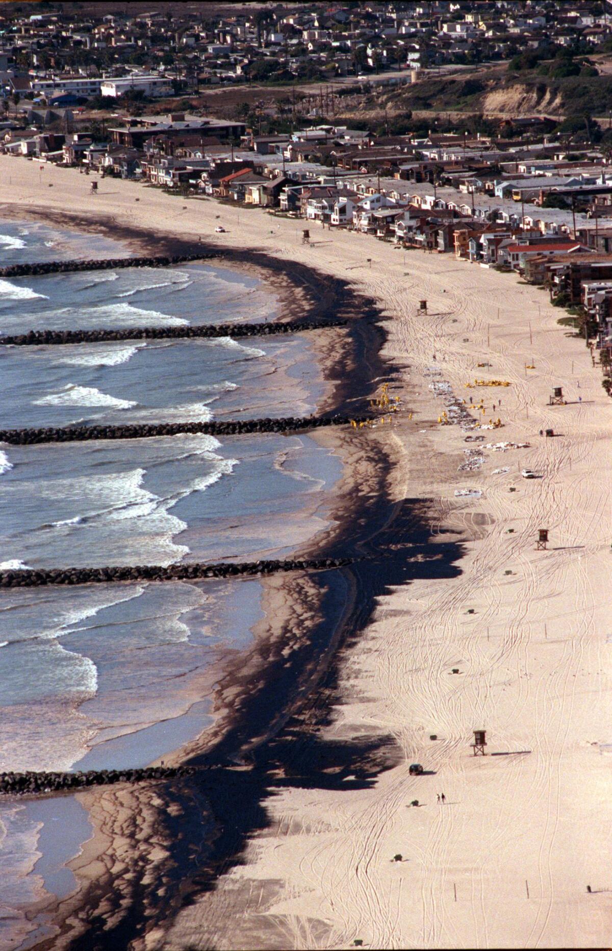 An oil spill washes ashore in Newport Beach