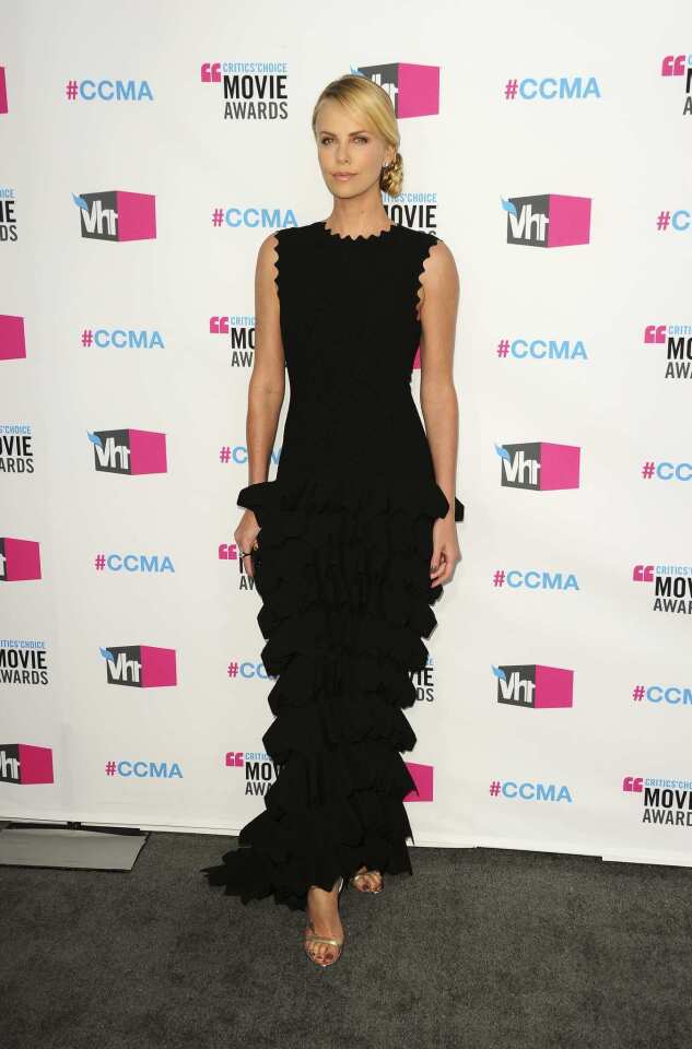 Charlize Theron's sculptural Azzedine Alaia gown was anything but basic black.
