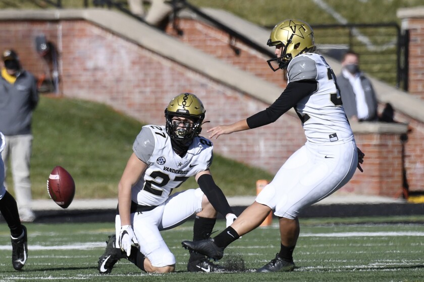 Vanderbilt's Sarah Fuller, right, kicks off as Ryan McCord holds to start the second half.