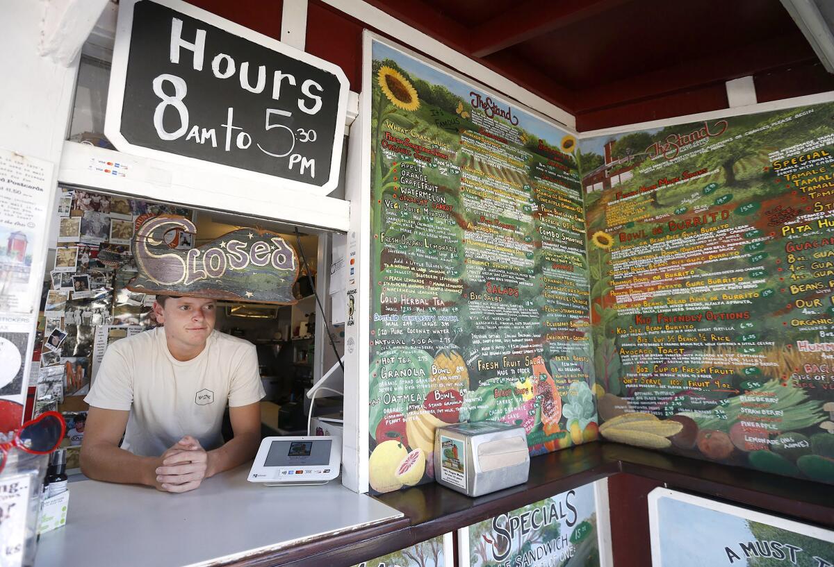 The Stand Natural Foods, an iconic eatery with its famous hand-painted menu.