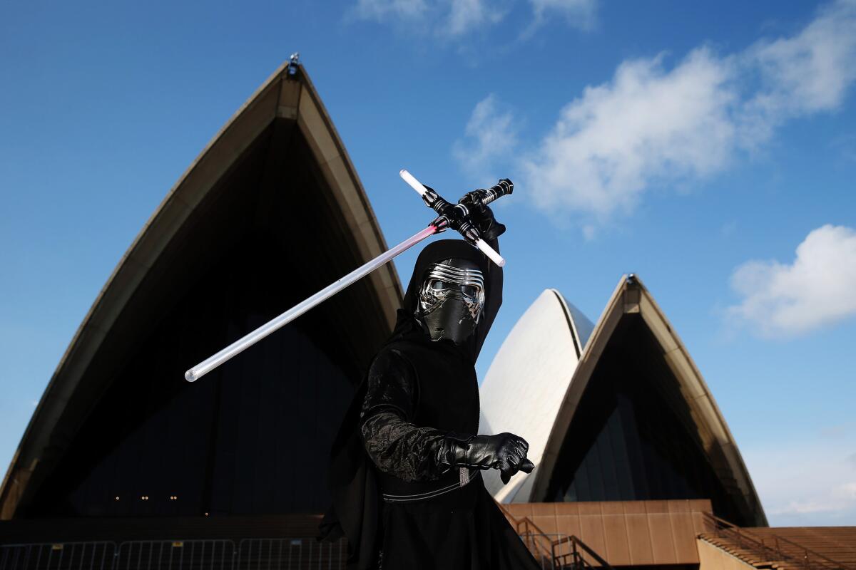 A fan poses at a "Star Wars: The Force Awakens" event at Sydney Opera House on Dec. 10, 2015, in Australia.