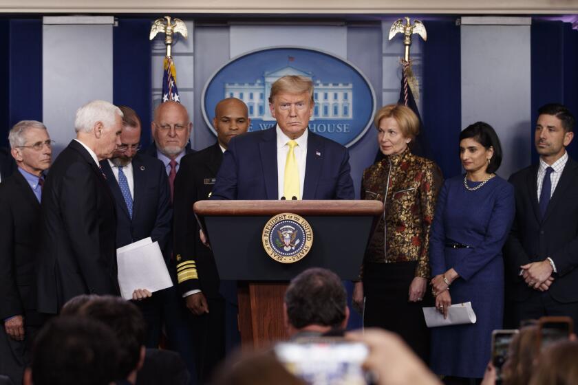 President Donald Trump pauses as he arrived to speak in the briefing room of the White House in Washington, Monday, March, 9, 2020, about the coronavirus outbreak as Dr. Anthony Fauci, director of the National Institute of Allergy and Infectious Diseases, Vice President Mike Pence, Health and Human Services Secretary Alex Azar, Dr. Robert Redfield, director of the Centers for Disease Control and Prevention, U.S. Surgeon General Jerome Adams, Dr. Deborah Birx, White House coronavirus response coordinator, Administrator of the Centers for Medicare and Medicaid Services Seema Verma, and Acting Secretary of Homeland Security Chad Wolf, listen. (AP Photo/Carolyn Kaster)