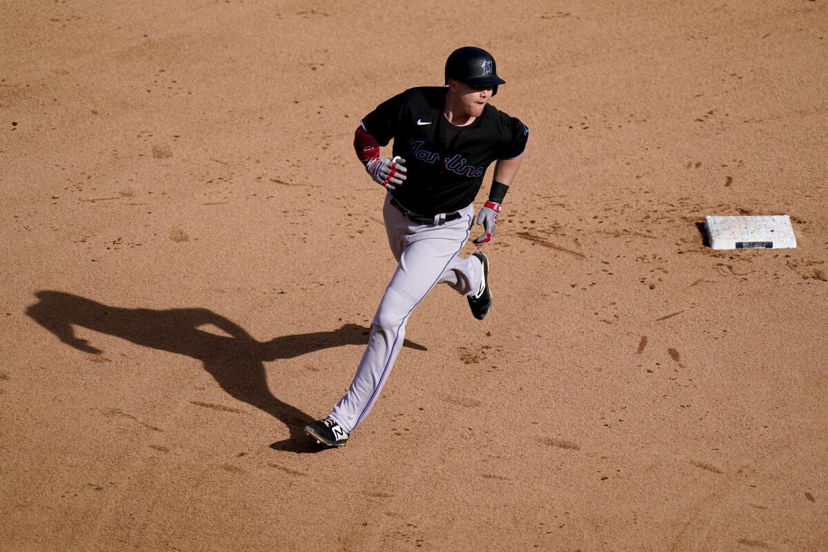 The Marlins' Garrett Cooper rounds the bases after homering in Game 2 of a NL wild-card baseball series on Oct. 2, 2020.