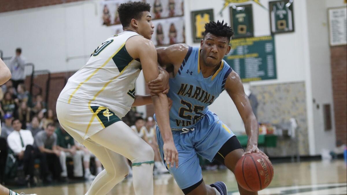 Marina High's Jakob Alamudun, pictured driving to the basket at Edison on Jan. 5, led the Vikings to a 58-52 win in the RPS 205 Tip-off Classic on Wednesday in Rockford, Ill.
