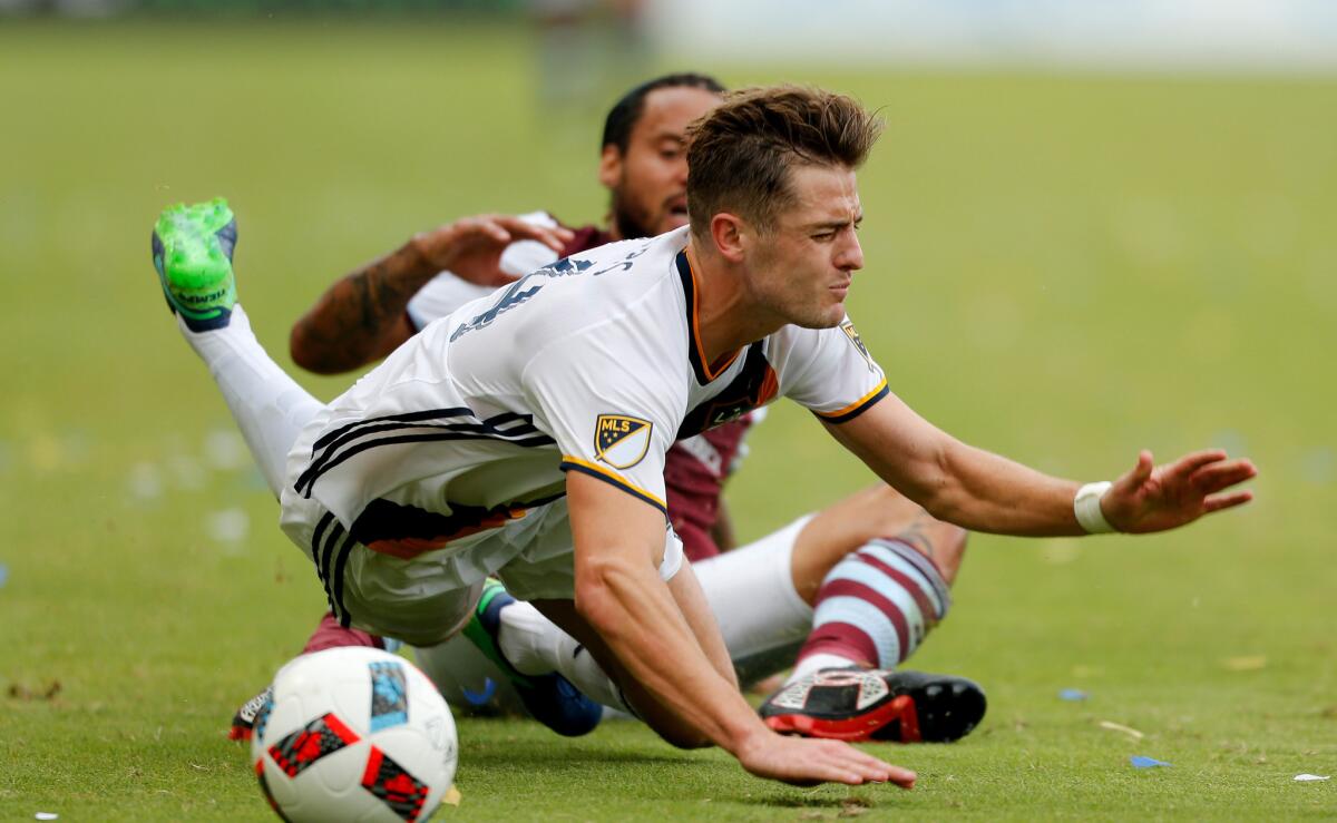 Colorado Rapids midfielder Jermaine Jones, rear, received a yellow card after taking down Galaxy forward Robbie Rogers during the second half in the first leg of an MLS semifinal in October 2016.