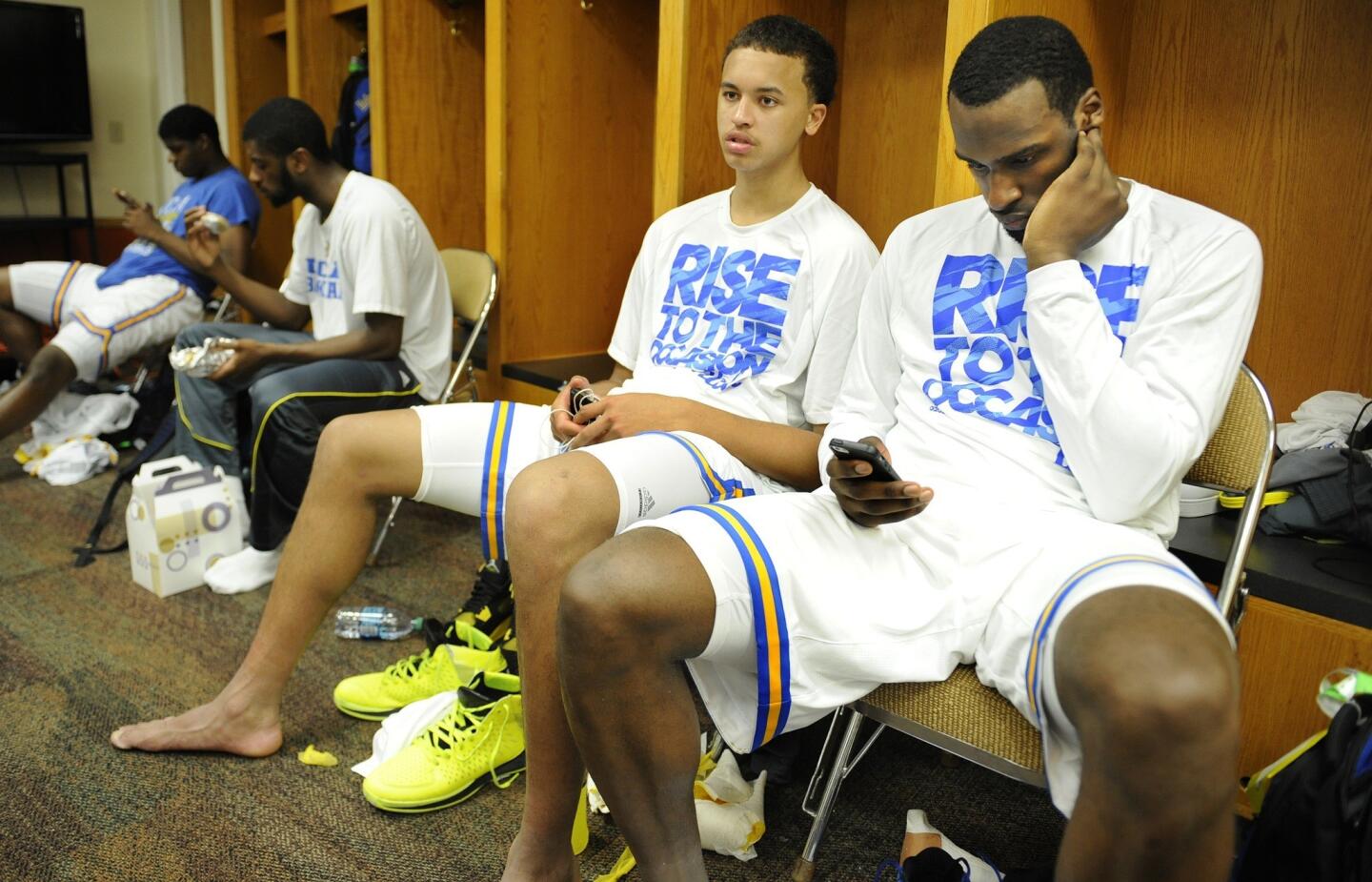 UCLA freshmen guards Kyle Anderson, left, and Shabazz Muhammad sit in the locker room after an 83-63 loss to Minnesota in the second round of the NCAA tournament on Friday night in Austin, Texas.