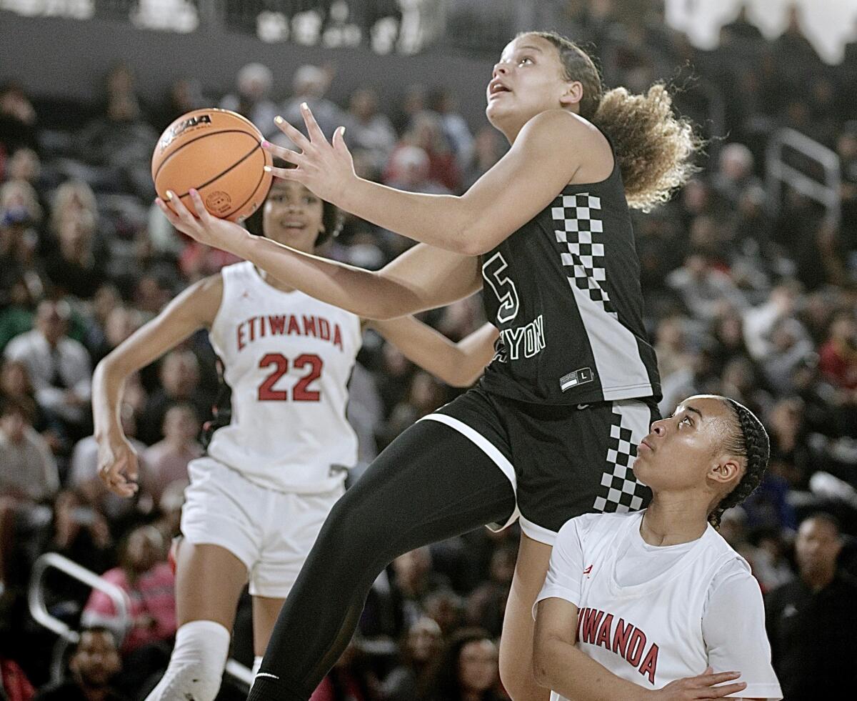 Sierra Canyon's Jerzy Robinson goes up for a shot against Etiwanda.