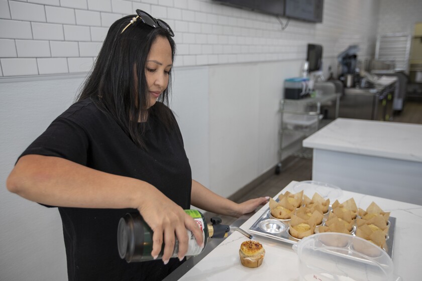 Abby Declaro bakes a vanilla cupcake at the Baked Dessert Bar.