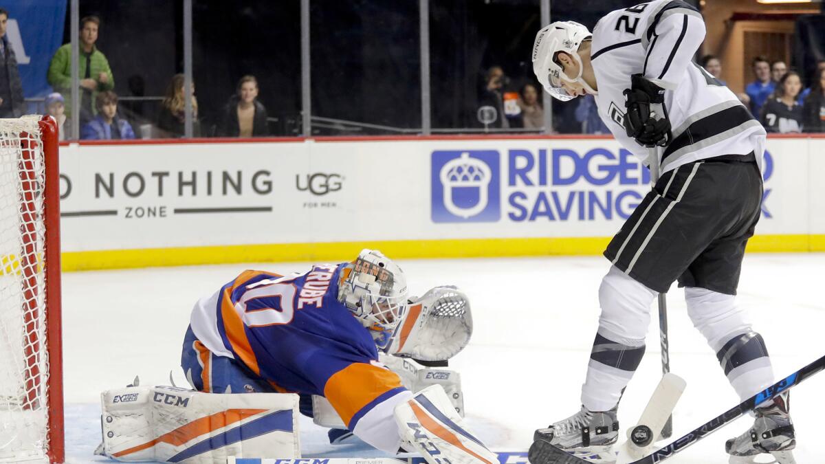 Kings center Nic Dowd has his shot attempt blocked by Islanders goalie Jean-Francois Berube during their game Saturday night.