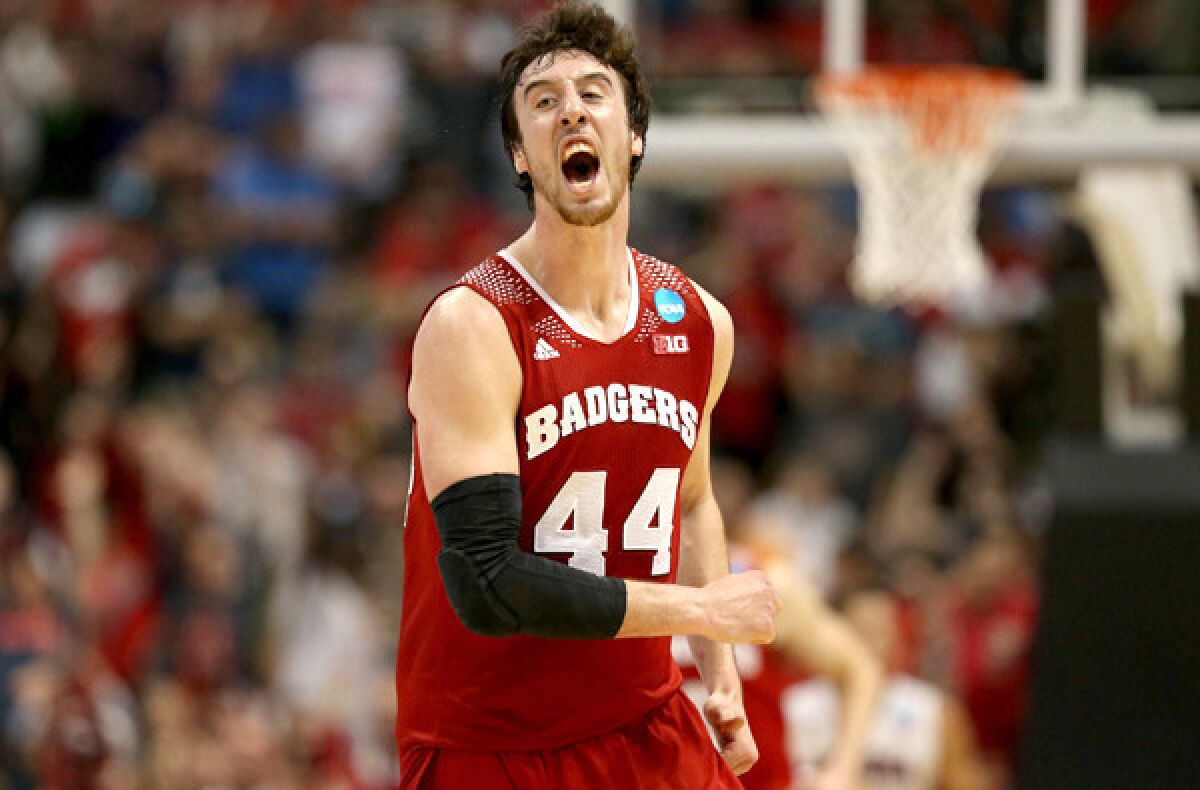 Wisconsin center Frank Kaminsky celebrates after making a three-pointer against Arizona in the second half of the West Regional final on Saturday night in Anaheim.