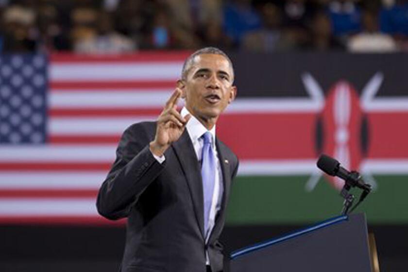 With the U.S. and Kenyan flags behind him, President Obama speaks Sunday at the Safaricom Indoor Arena in Nairobi.