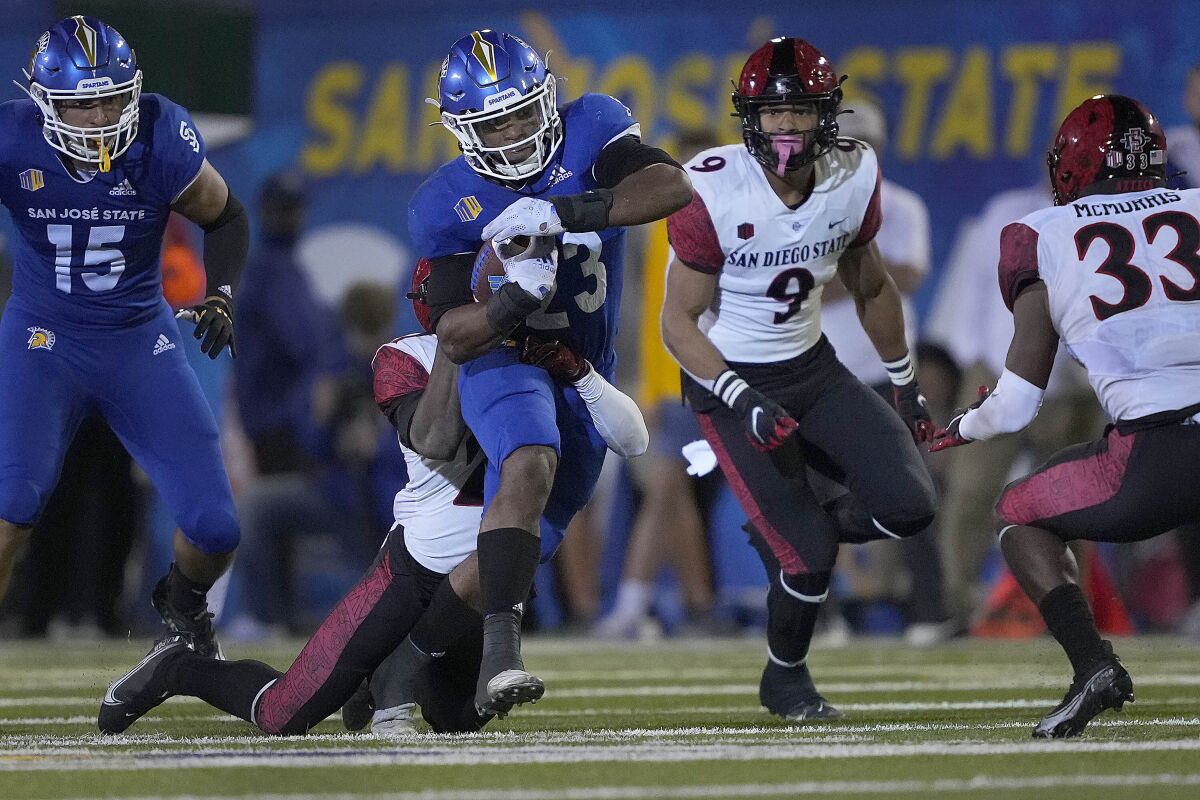 San Jose State running back Tyler Nevens is stopped by the San Diego State defense.