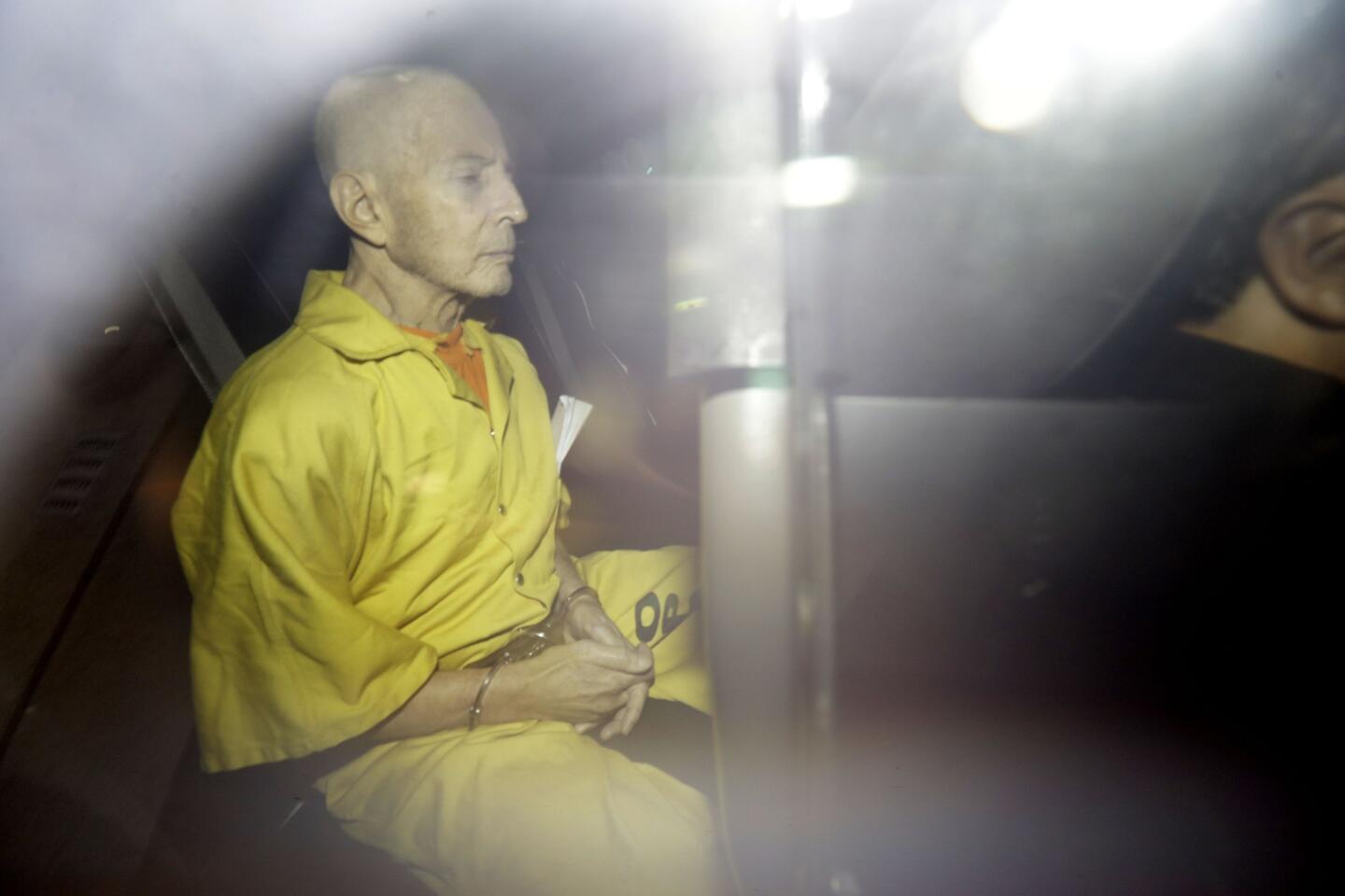 In this Tuesday, April 14, 2015 file photo, Robert Durst leaves Federal Court in an Orleans Parish Sheriff's vehicle after his arraignment. An attorney for jailed real estate heir Robert Durst says Thursday, April 23, 2015, state weapon charges have been dropped against the millionaire, clearing the way for federal proceedings in New Orleans on similar charges.