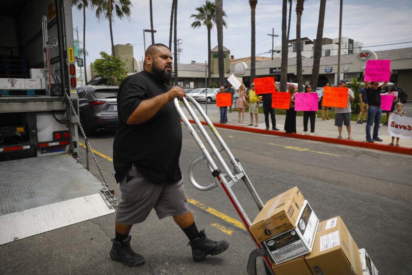 North Park residents and business owners lined 30th Street to protest city designated bike lanes along 30th Street.