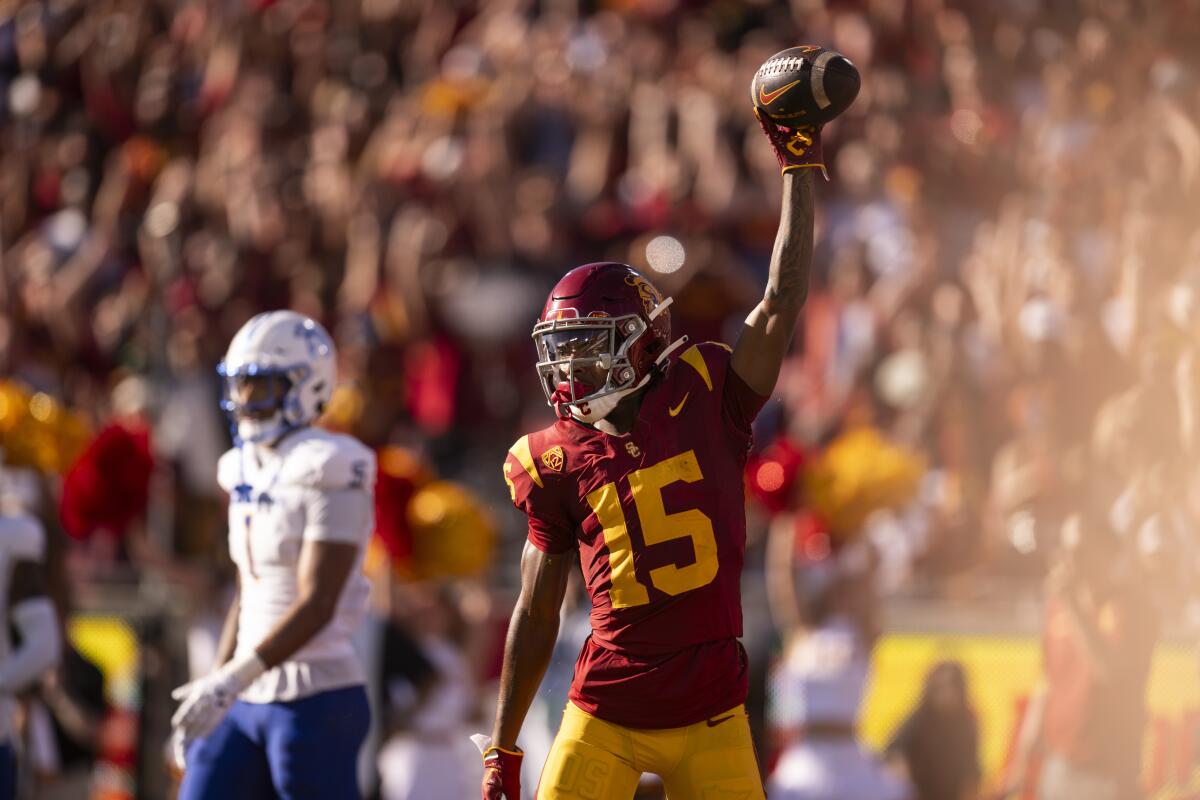USC wide receiver Dorian Singer raises his ball after scoring a touchdown against San José State on Aug. 26.