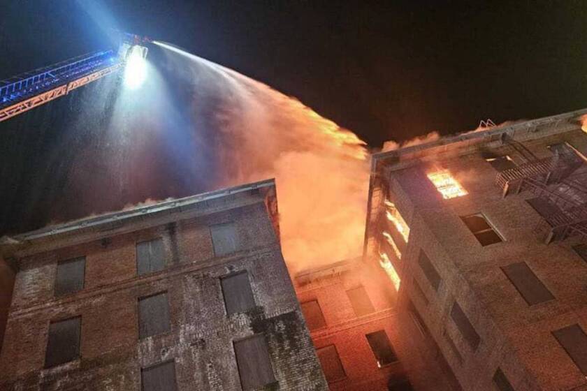 Firefighters work to douse flames from the top floor of the Hotel Marysville. on June 15, 2024.
