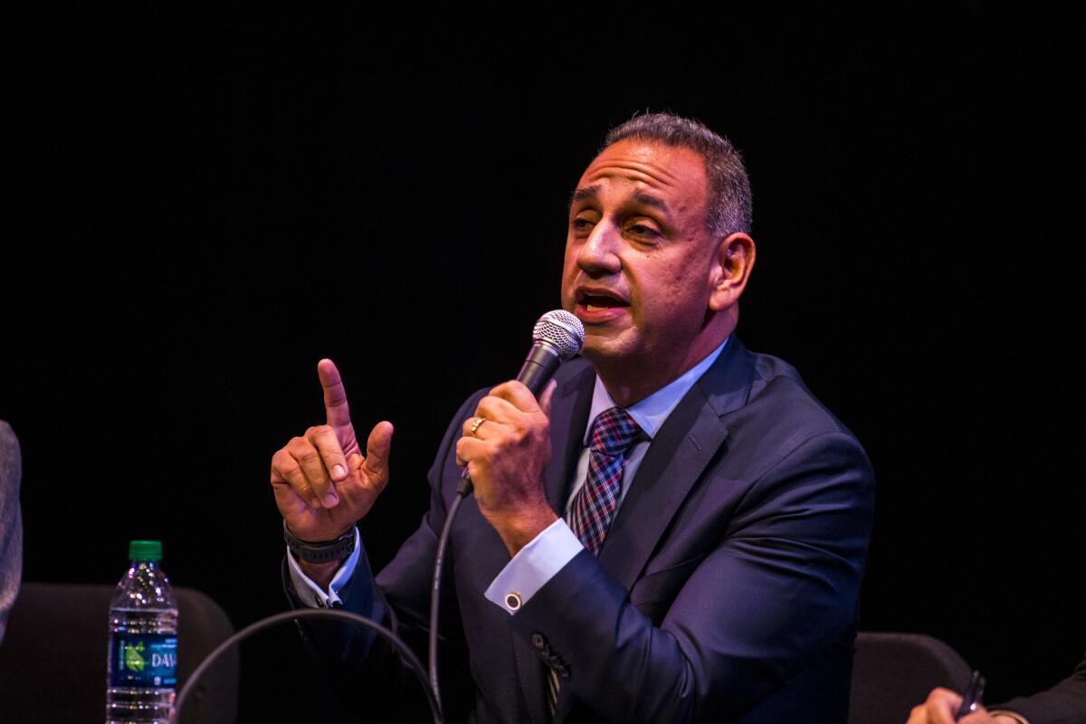 Gil Cisneros speaks during a forum at Fullerton College in January.
