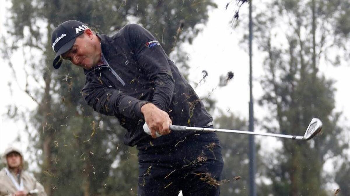 Sam Saunders hits from the rough on Saturday during the second round of the Genesis Open at Riviera Country Club.