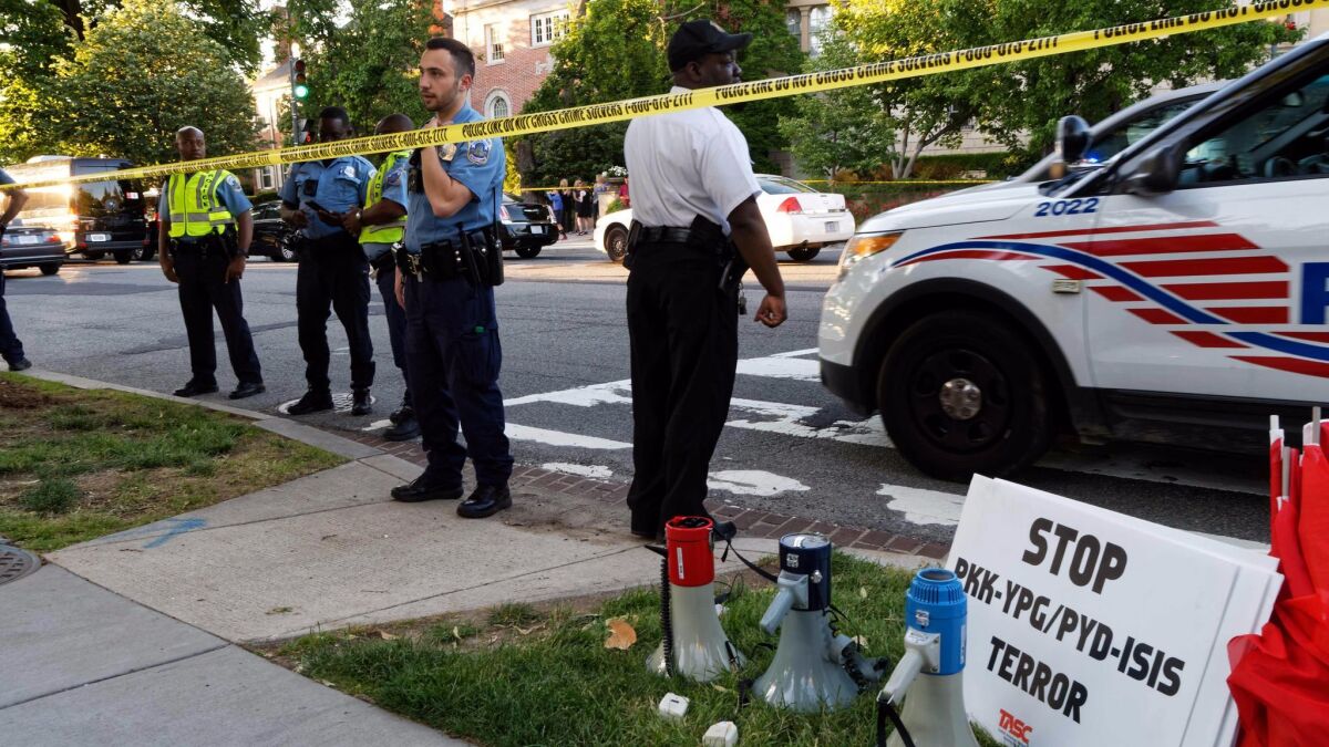 Police secure the street outside the Turkish Embassy in Washington during a visit by Turkish President Recep Tayyip Erdogan on May 16. Turkish security officers were seen hitting and kicking protesters during Erdogan's visit.