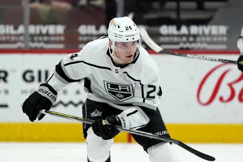 Los Angeles Kings center Lias Andersson skates to the puck against the Arizona Coyotes during the second period of an NHL hockey game Monday, May 3, 2021, in Glendale, Ariz. (AP Photo/Ross D. Franklin)