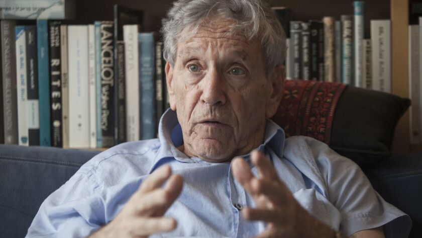 Israeli writer Amos Oz, shown at his home in Tel Aviv in 2015, has died, his family announced Friday.