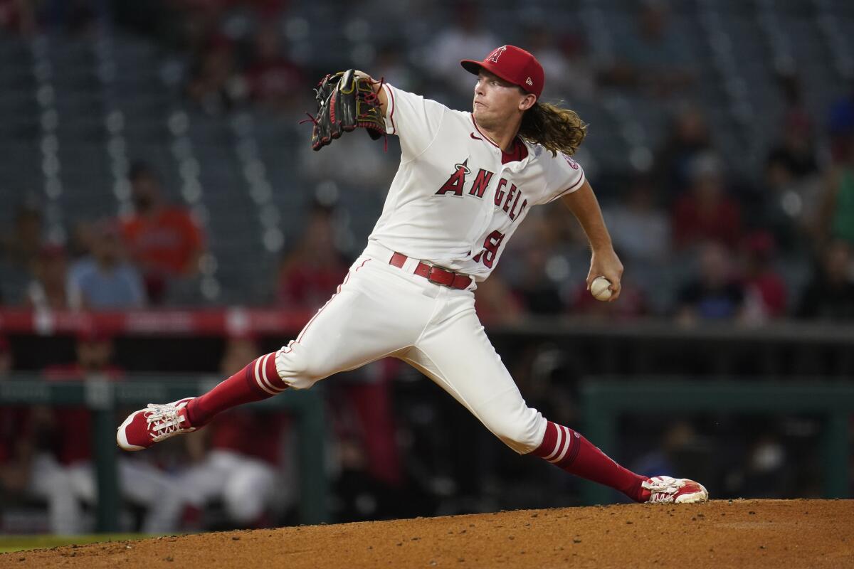 Angels starter Packy Naughton throws during a game against the Astros 