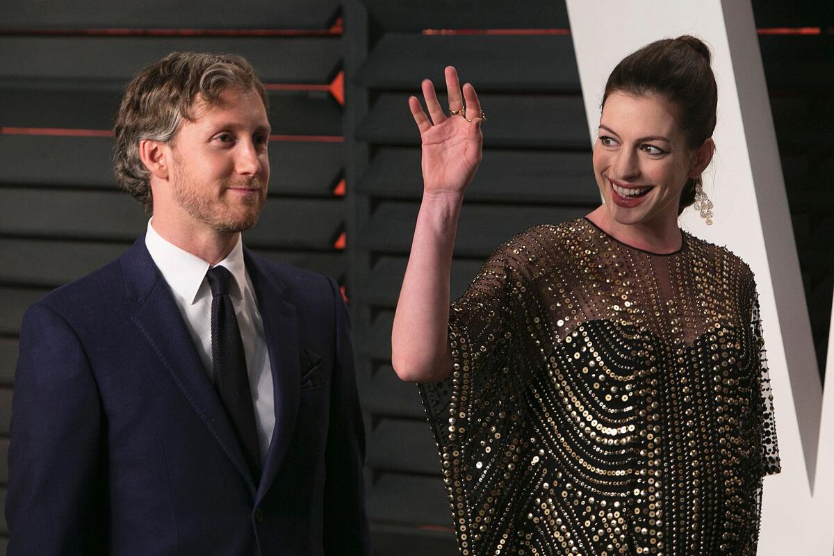 Anne Hathaway, photographed with husband Adam Shulman as they arrived at the 2016 Vanity Fair Oscar Party in Beverly Hills, reportedly gave birth to a son on March 24.