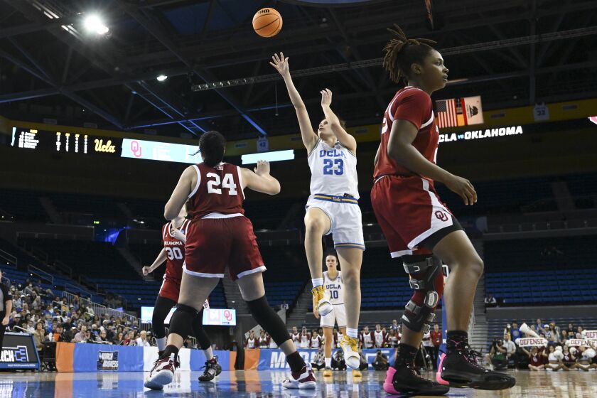 LOS ANGELES, CA - MARCH 20: Gabriela Jaquez #23 of the UCLA Bruins shoots an off-kilter shot over Skylar Vann #24 of the Oklahoma Sooners during the second round of the 2023 NCAA Women's Basketball Tournament held at UCLA Pauley Pavilion on March 20, 2023 in Los Angeles, California. (Photo by John W. McDonough/NCAA Photos via Getty Images)