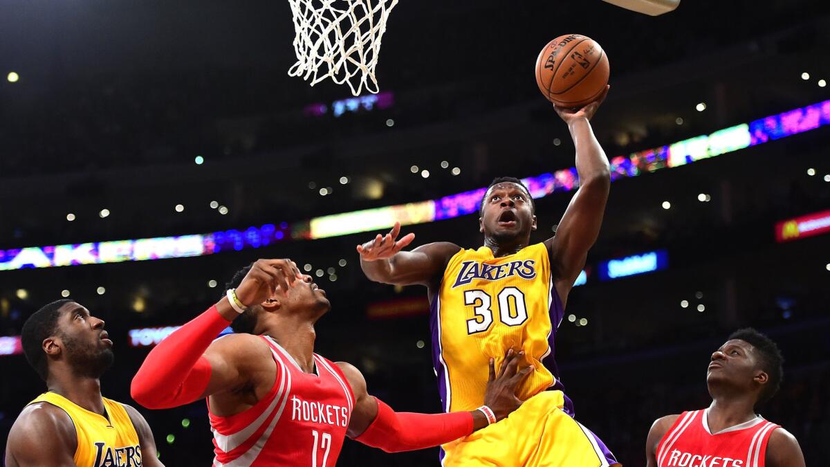 Lakers forward Julius Randle drives for a layup against the Rockets on Thursday night.