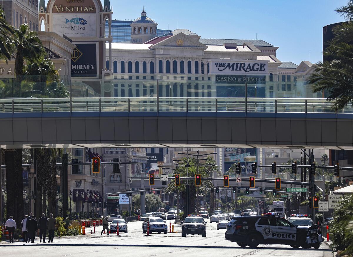 Police cars on a closed stretch of Las Vegas Boulevard