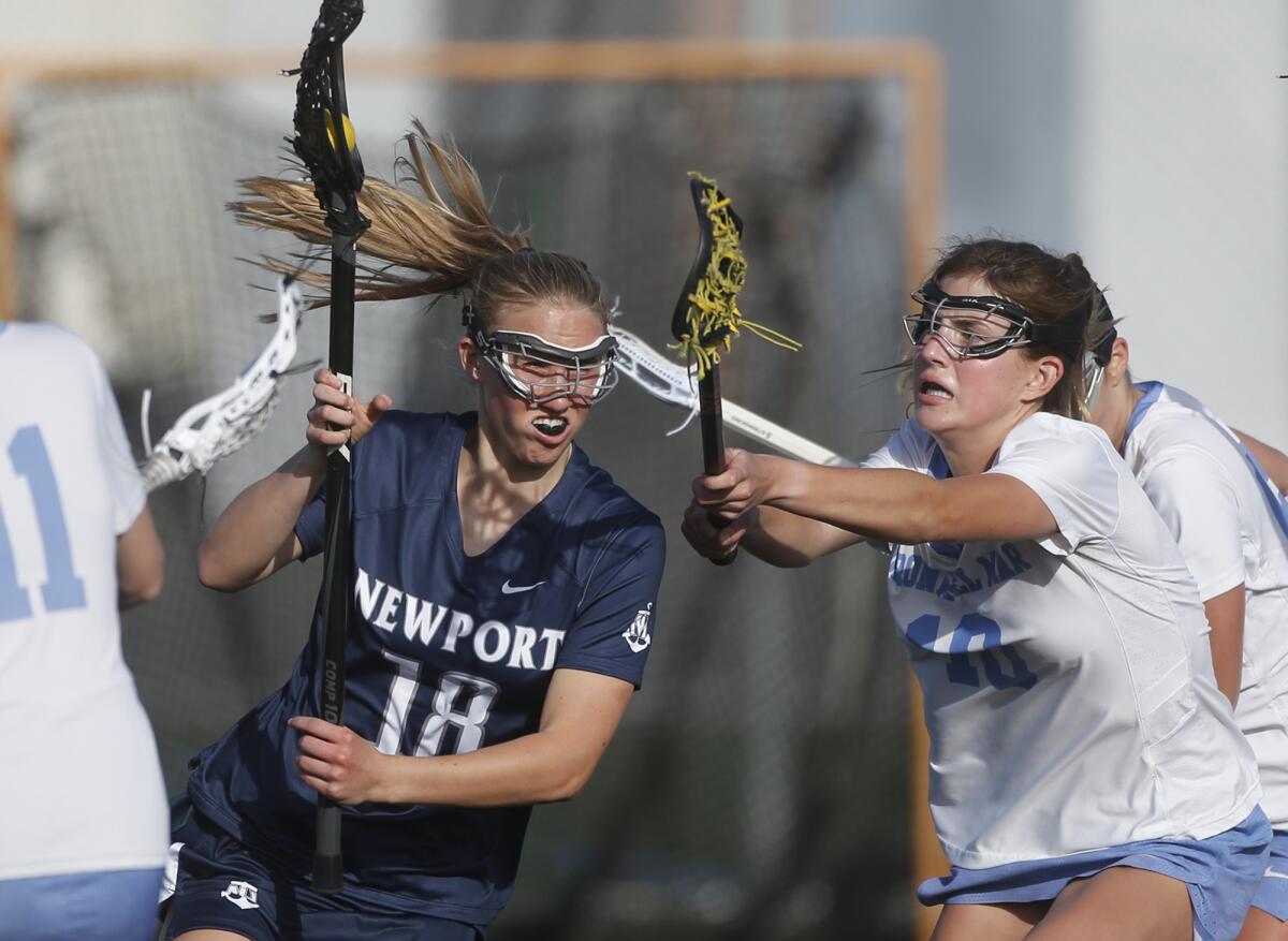 Newport Harbor's Casey Sharbrough (18) breaks toward the goal for a score on Thursday.