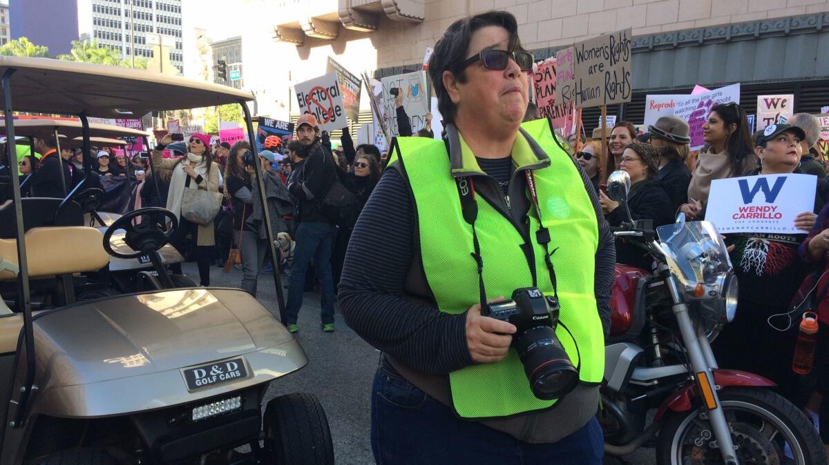 Artist Catherine Opie waits for the Women's March to kick off in downtown Los Angeles.