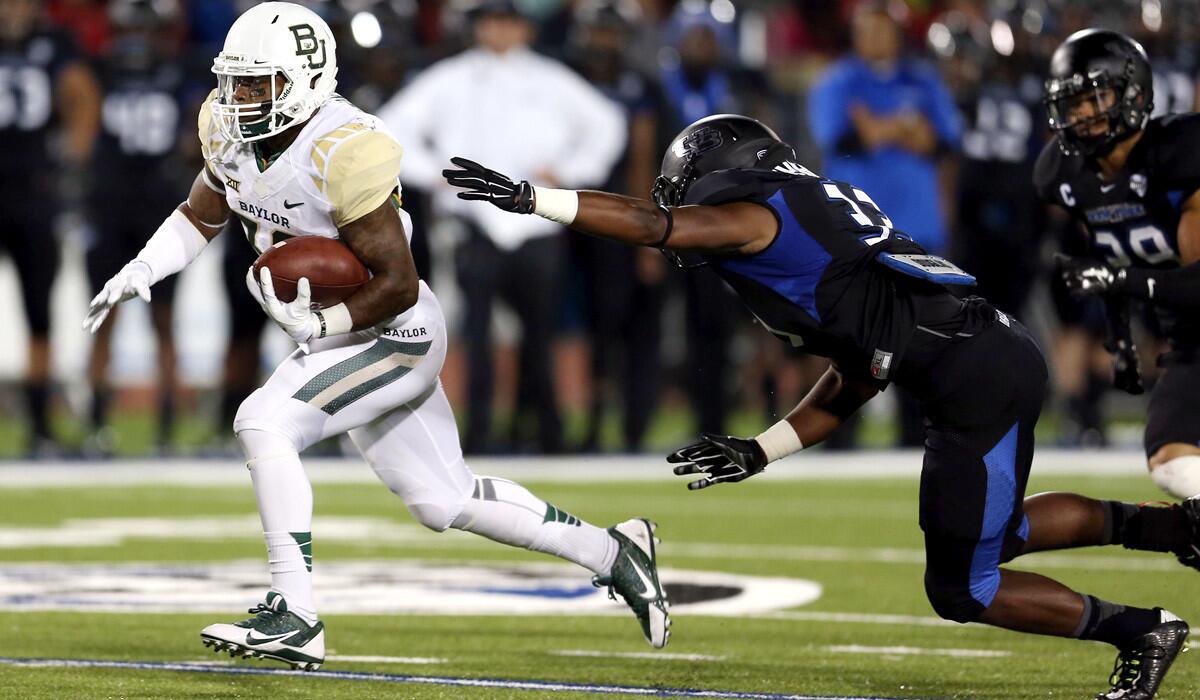 Baylor running back Shock Linwood breaks free against Buffalo to score one of his two touchdowns on Friday night.