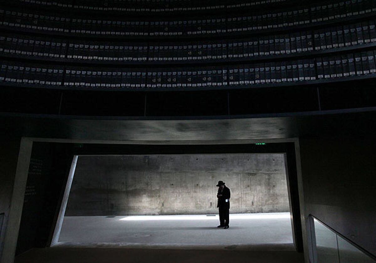 A man pauses inside the Yad Vashem Holocaust memorial museum in Jerusalem.