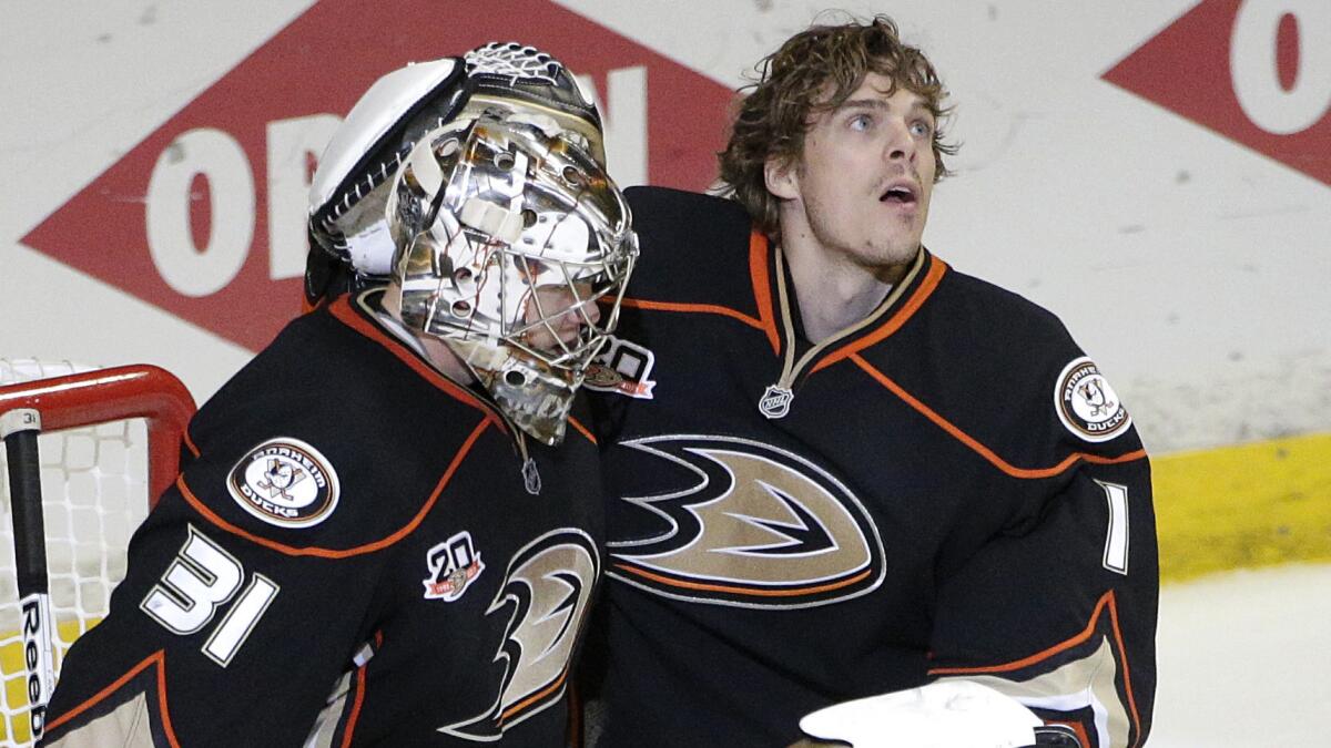 Ducks goalies Frederik Andersen, left, and Jonas Hiller celebrate their victory over the Dallas Stars in Game 3 of the Western Conference quarterfinals. Which netminder will be in the crease for the start of the Ducks' second-round playoff series?