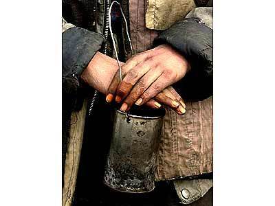 A young girl begs for money on the streets of Kabul, Afghanistan. The former Taliban has forced women out of work and into the streets to earn a living.