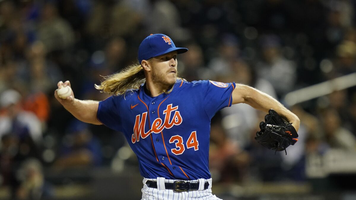 Right-hander Noah Syndergaard delivers a pitch.