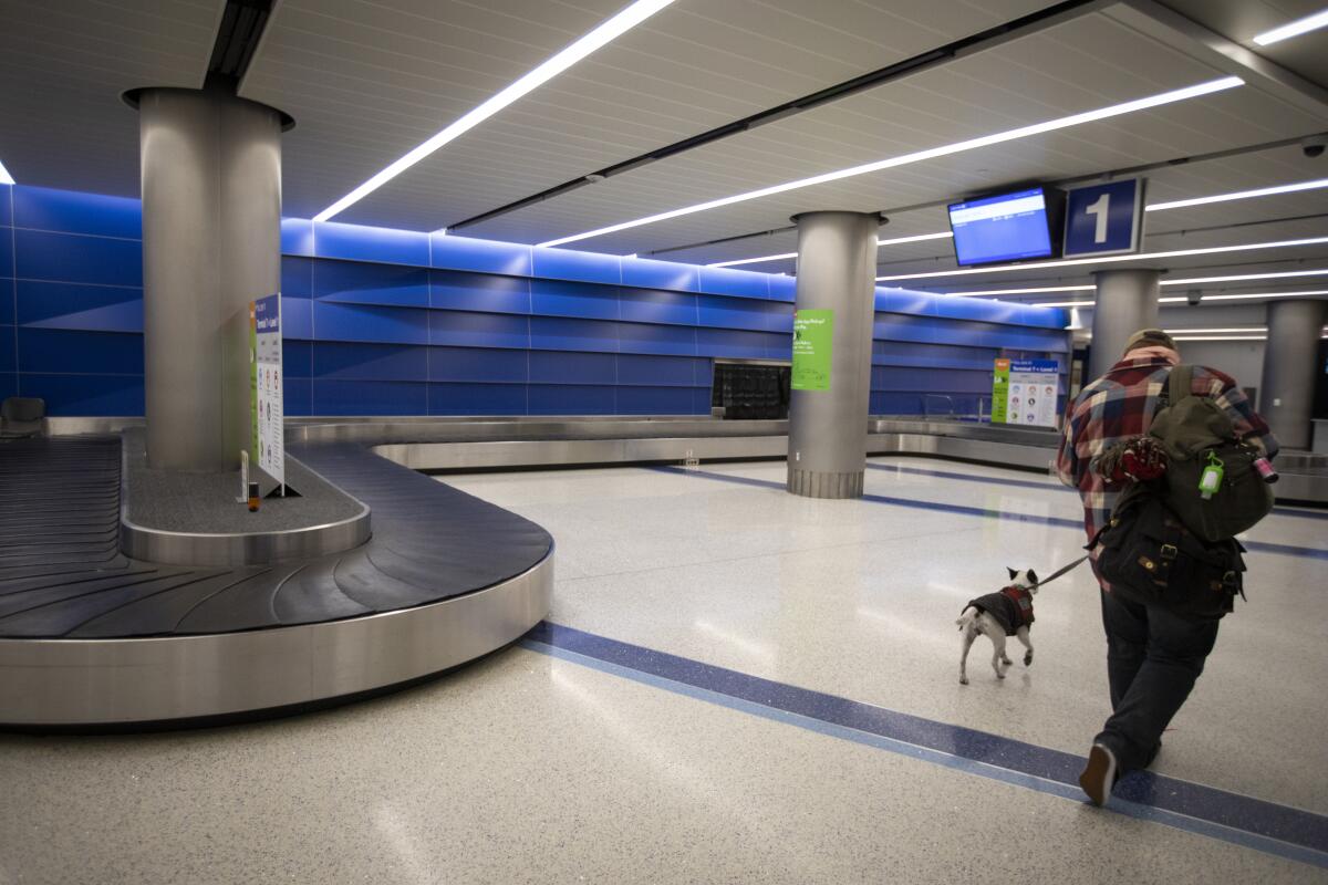 A man and his dog at LAX airport