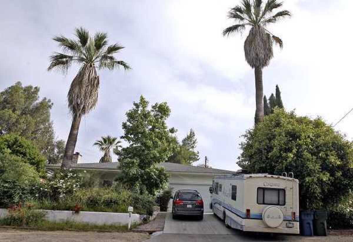 A recreational vehicle is parked at 1425 Curran St. in La Cañada Flintridge. The city will vote on a zone change Tuesday that would require RV owners to undergo a city review.