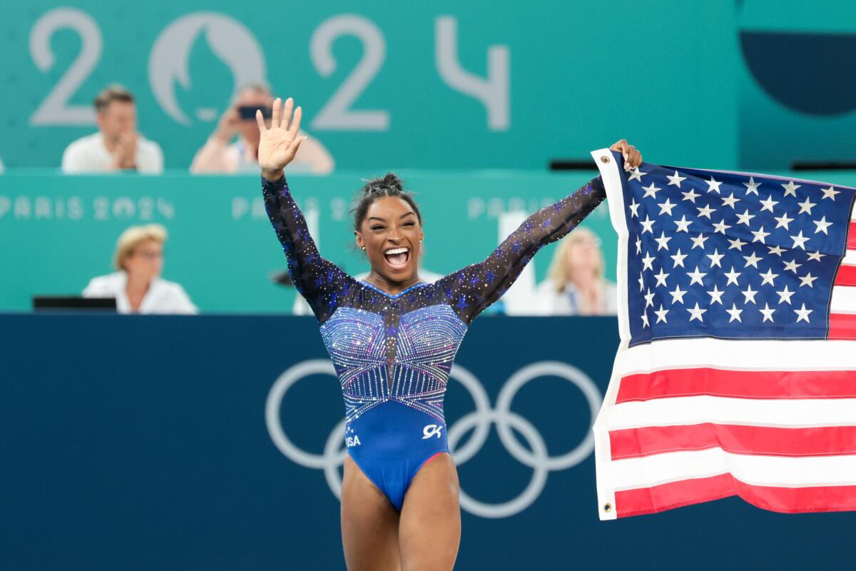 Simone Biles celebrates after winning the gold medal. 
