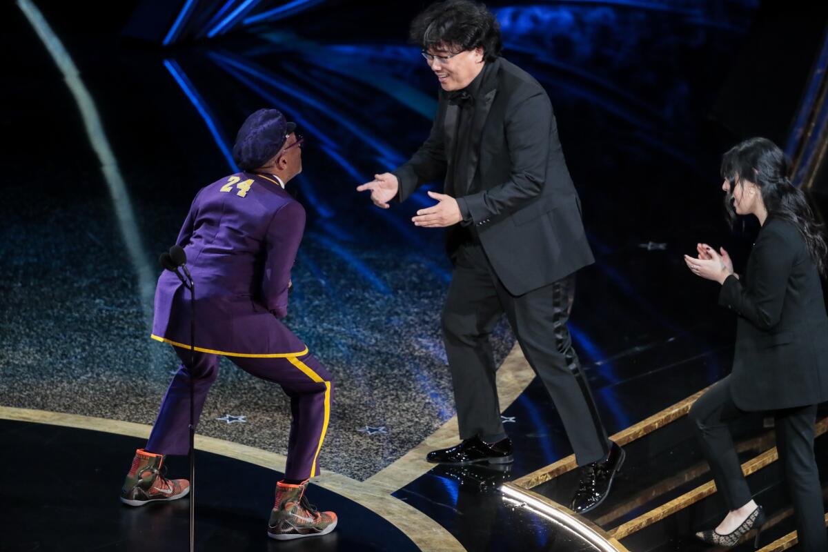 Spike Lee congratulates Director Bong Joon Ho, winner of the director Oscar and international feature Oscar for “Parasite” during the telecast of the 92nd Academy Awards.