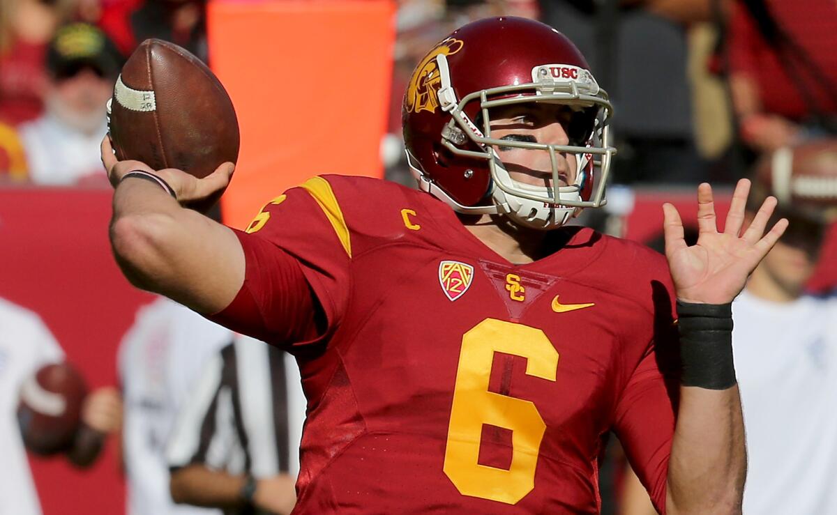 USC quarterback Cody Kessler throws downfield against UCLA in the first quarter.