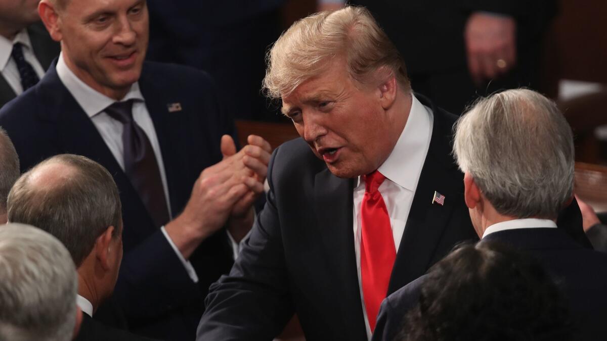 President Trump greets Supreme Court justices on Feb. 5 after his State of the Union address.