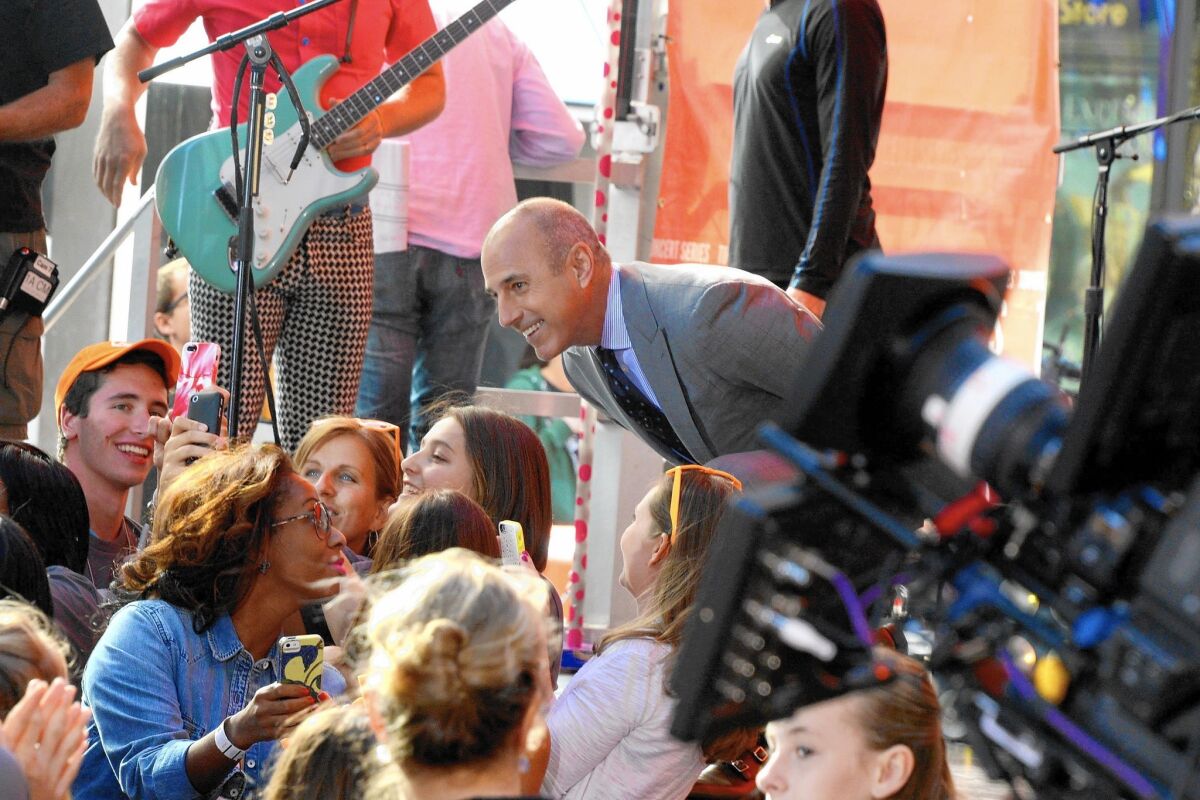 Matt Lauer greets fans at NBC's "Today" show. "Today" is one of the most profitable shows on television.