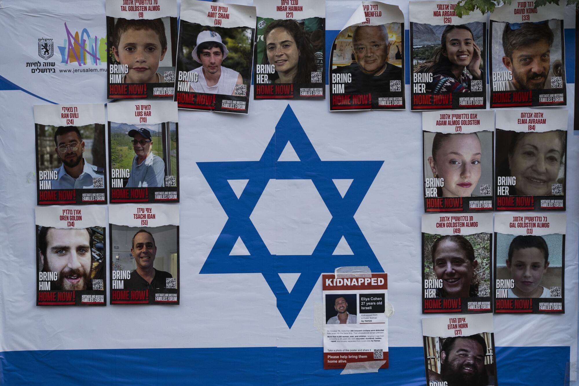 Wall showing photos of Israelis kidnapped during Hamas' Oct. 7 attack