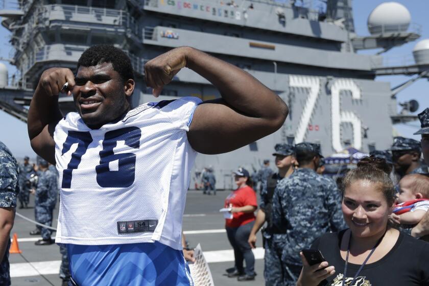 San Diego Chargers offensive tackle D.J. Fluker poses while taking part in a training camp session on the flight deck of the aircraft carrier Ronald Reagan in Coronado. A Yahoo Sports report says Fluker received impermissible benefits while at Alabama.